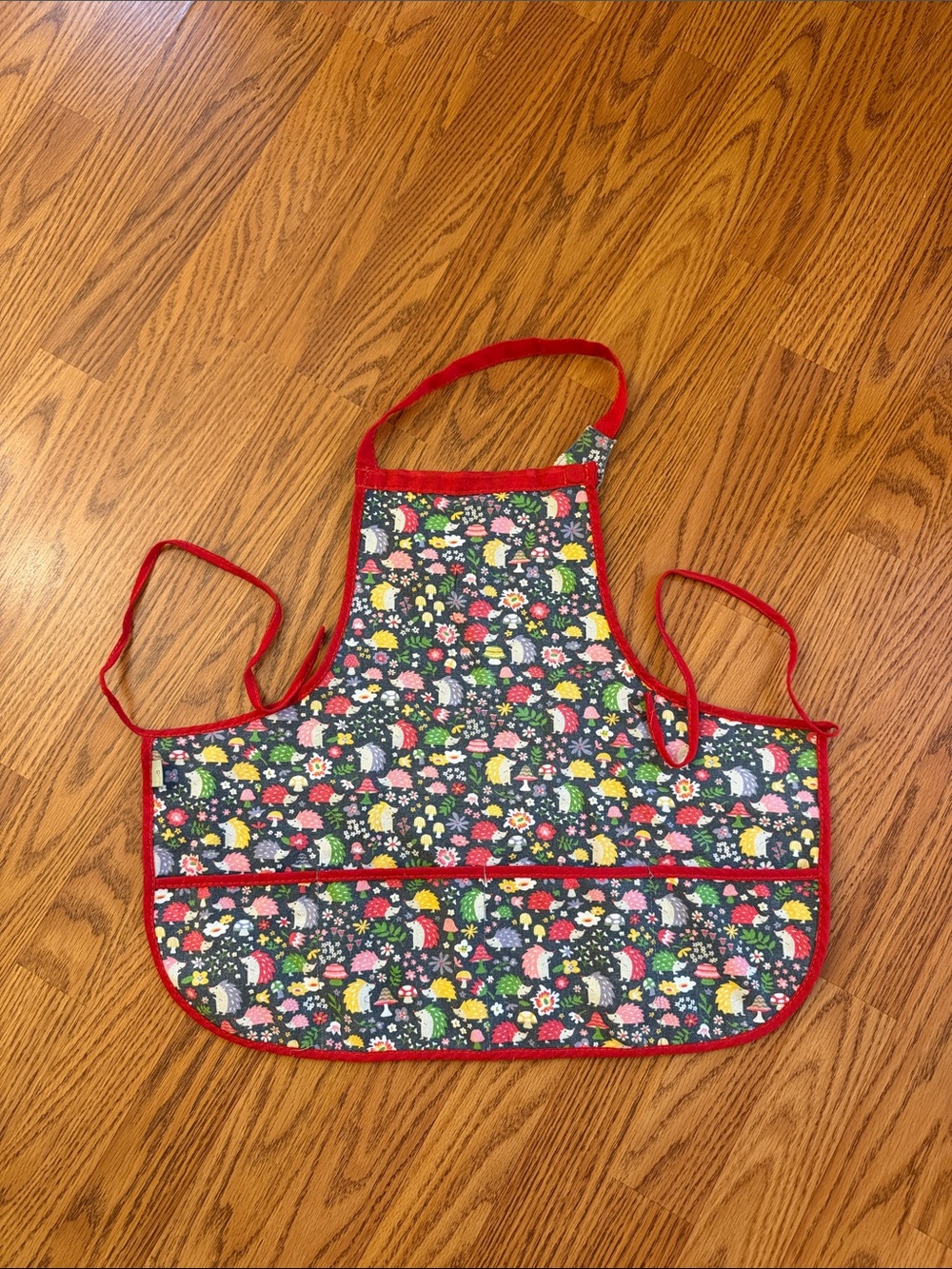 Kids Floral Hedgehog Apron with Red Trim for toddler